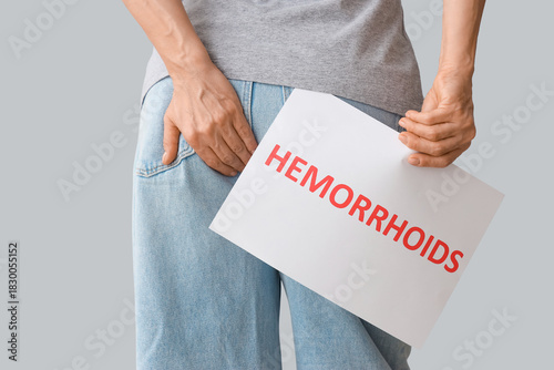 Mature woman holding paper ...