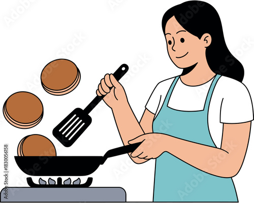 Joyful woman cooking pancakes on a stovetop with a spatula flipping them in a pan.