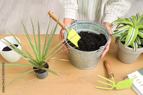 Young woman transplanting p...