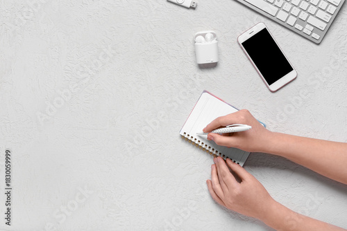 Female hands writing with p...
