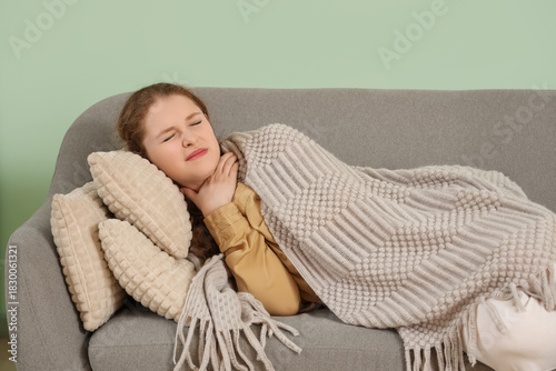 Sick young woman with sore ...