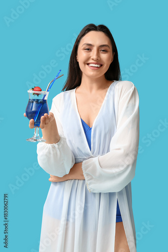 Happy young woman holding g...