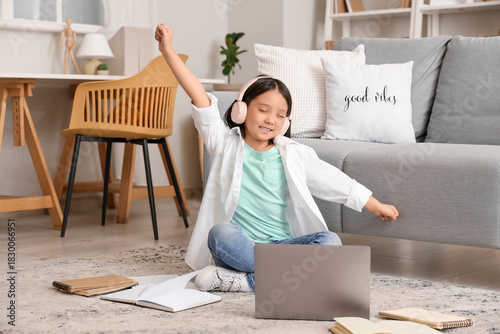 Happy little Asian girl in ...