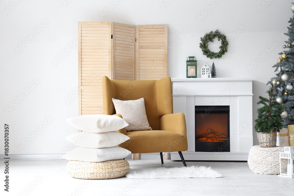 Fototapeta premium Interior of modern living room with fireplace decorated for Christmas
