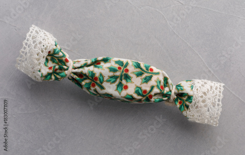 Christmas candy in fabric wrapping with lace