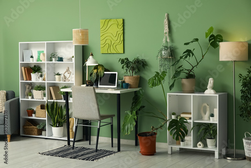Stylish workplace with lapt...