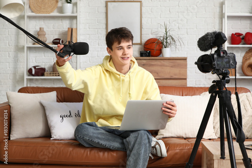 Teenage blogger with laptop...