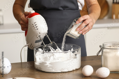 Woman whipping egg albumen ...