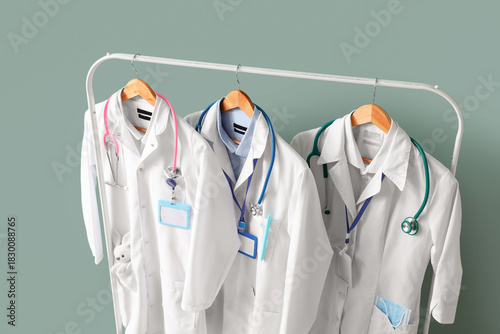 Rack with doctor's uniform ...