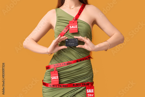 Young woman in ribbon with ...