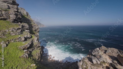 View of Cape Point from the Cape of Good Hope with the upper lighthouse shrouded in mist, which is why the lower one was built. Table Mountain National Park. Cape Town. Western Cape. South Africa.:
