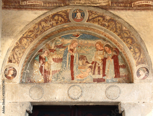 Natività  con i Santi Rocco e Defendente; lunetta del portale della chiesetta dei Santi Rocco e Defendente a Clusone (Val Seriana, Bergamo)