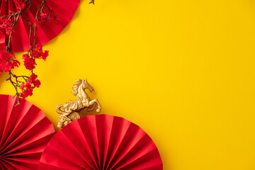 Happy Chinese New Year banner template. Gold horse with red paper fans and cherry blossom branch on yellow background