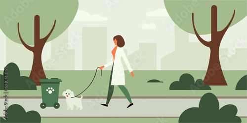 Woman walking her dog in the park with a pet waste station