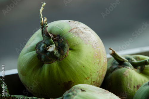 Green coconuts on the street 