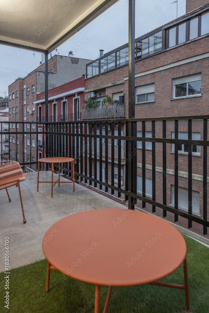 Obraz premium Family terrace with a children's play area, sandbox, and safe furniture for enjoying with children in an urban setting
