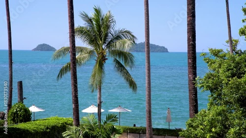 Luxurious Tropical Beach View with White Umbrellas on Koh Chang Island, Thailand