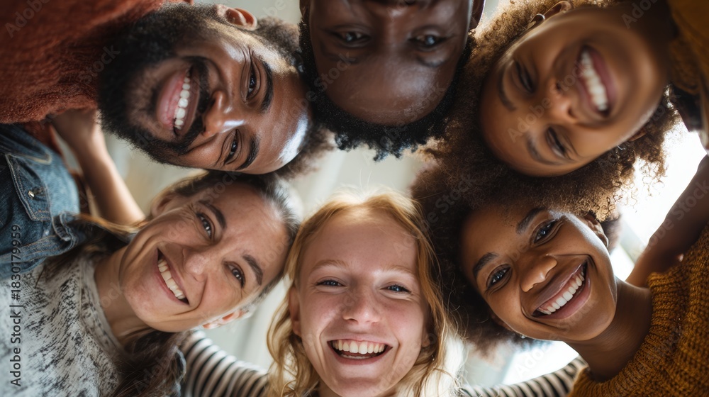 Fototapeta premium Joyful group of friends celebrating together indoor setting candid photo warm environment upward angle togetherness