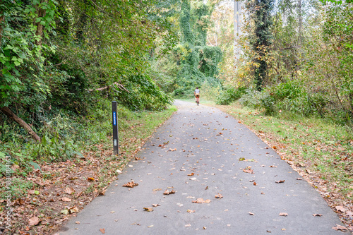 Man riding bike on James River Heritage Trail in Lynchburg, Virginia past Blackwater Creek