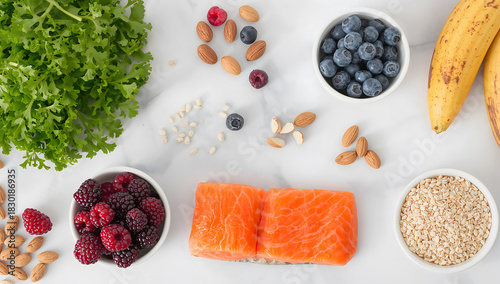 Healthy lifestyle concept featuring a colorful array of fresh foods such as salmon, blueberries, raspberries, and almonds for a balanced diet