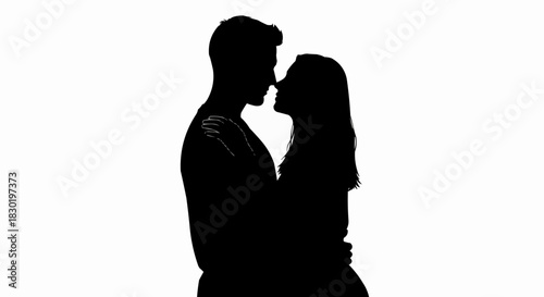 Silhouette of a loving couple embracing each other in a tender moment.
