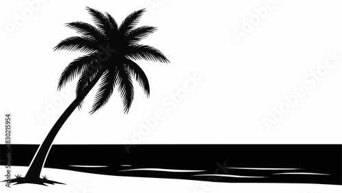 Solitary black silhouette of a tropical palm tree on a beach.