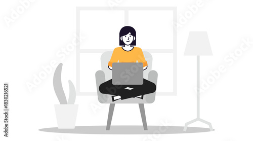 Young woman working on laptop at home focused and productive.