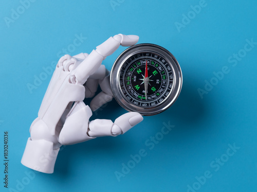Artificial Intelligence Guiding: Robot Hand Holding Compass for Direction Technology