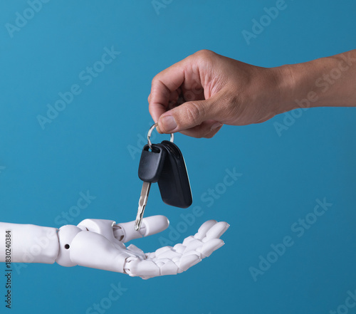 Future of Mobility: Human Handing Car Keys to Robot Hand, Symbolizing AI Takeover