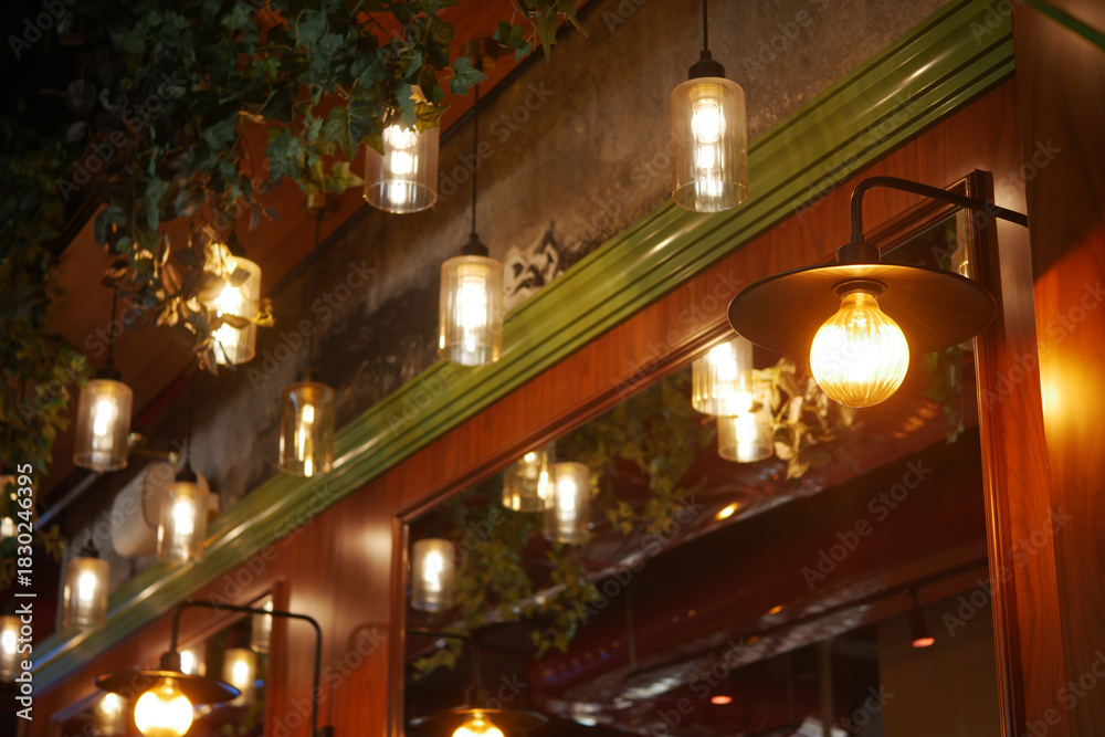 Fototapeta premium Decorative lighting enhances cozy cafe atmosphere at night