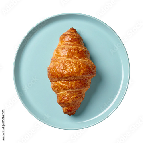 Golden Croissant on Blue Plate: A delectable, freshly baked croissant, boasting a rich, golden hue, rests gracefully upon a serene blue plate, a simple yet elegant composition.
