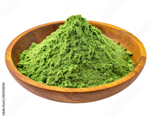 Green powder piled in a round, wooden bowl