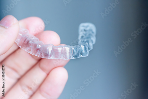  clear aligners device in the mouth on a white background. (invisalign)