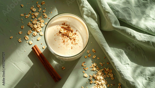 Overhead creamy Oat Milk Smoothie scattered rolled oats