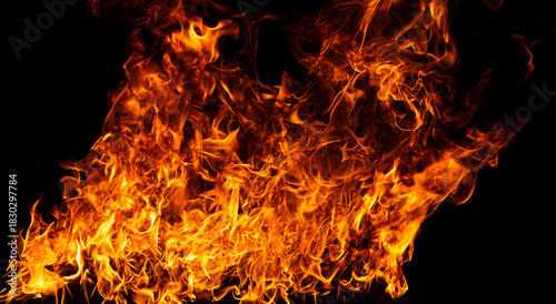 Glowing flames on black background. Inferno effect with flame. Flames with dramatic fire background. Burning flame. Intense blazing fire background. Fire abstract background with flame.