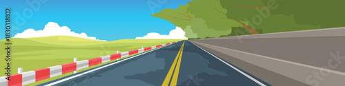 Banner landscape of wide asphalt road destination ahead. On one side is a dense forest with a barrier and on the other side guardrail is a vast hill. Under blue sky and white clouds.