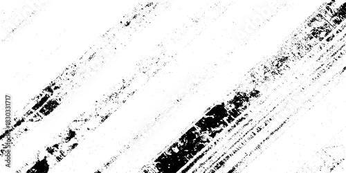 Abstract texture grunge made of diagonal streaks and distressed lines, black ink on a white background. grunge scratch patterns, chaotic linear noise. dirty monochrome pattern of the old worn surface.
