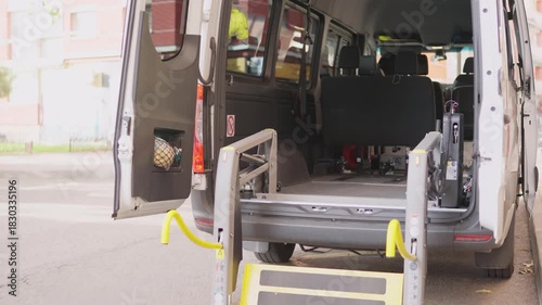 Accessible van wheelchair lift folding inside the vehicle