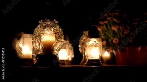 Votive Candle Lanterns on Surface of Limestone Grave Tombstone at All Saint Day Evening