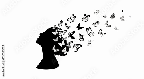 Silhouette of a woman's head with butterflies transforming into her hair, symbolizing freedom and transformation.