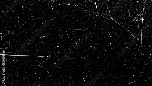 A versatile black grainy background teeming with dust and scratch details.