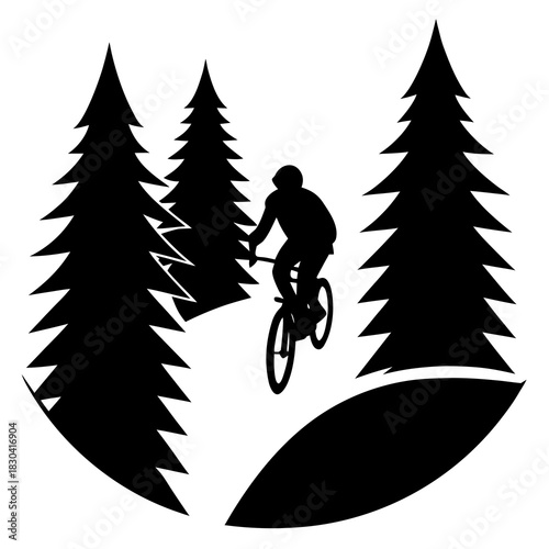 Silhouette of a mountain biker jumping through pine trees