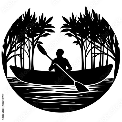 Silhouette of a person kayaking through a forest on a lake