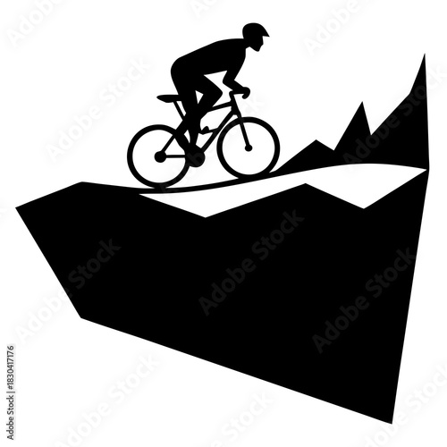Silhouette of a mountain biker riding downhill on a rocky terrain