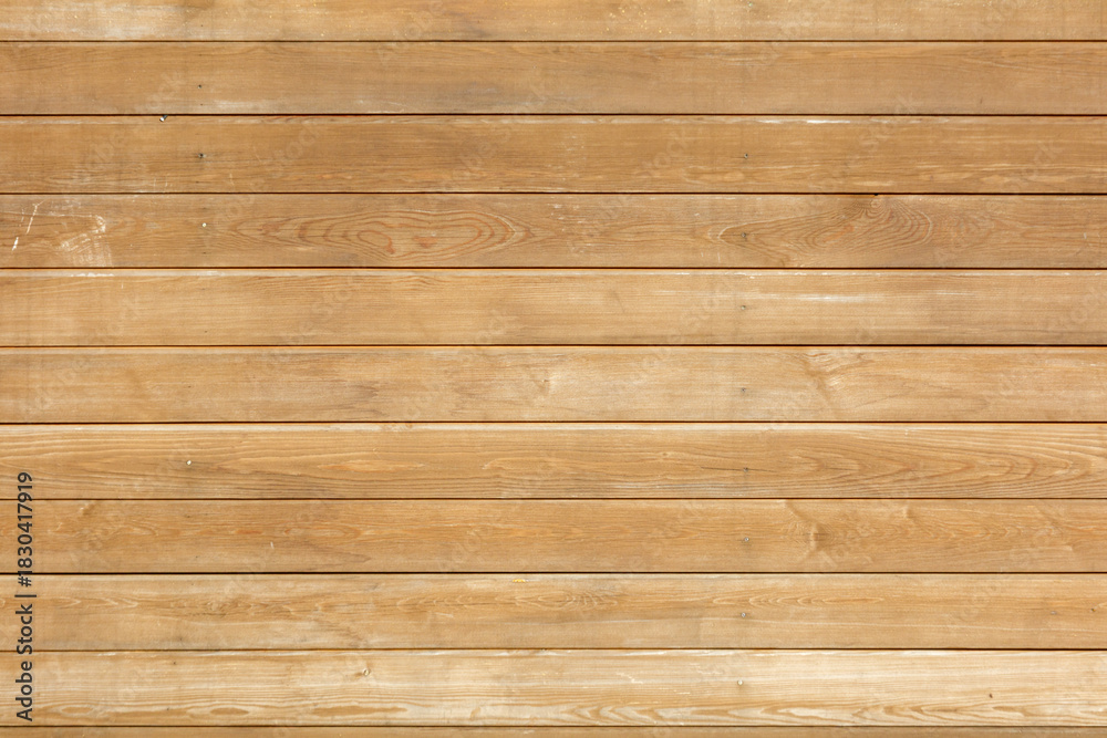 Fototapeta premium A wooden wall with a grainy texture