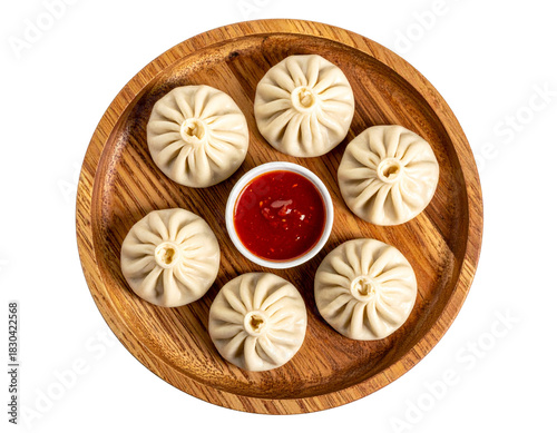 Wallpaper Mural Steamed Chicken Momos Neatly Arranged on Wooden Plate with Chilli Garlic Sauce, Isolated PNG Torontodigital.ca