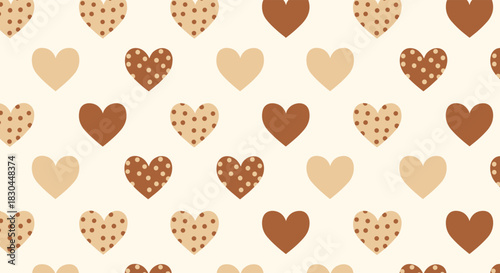 Adorable seamless pattern featuring various hearts in warm brown and beige colors, some decorated with polka dots, on a soft cream background.