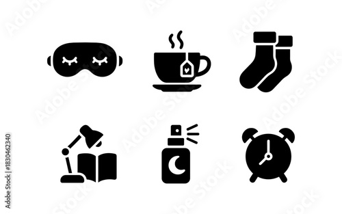 Nighttime routine essentials: sleep mask, tea, warm socks, reading lamp, lavender spray, alarm clock