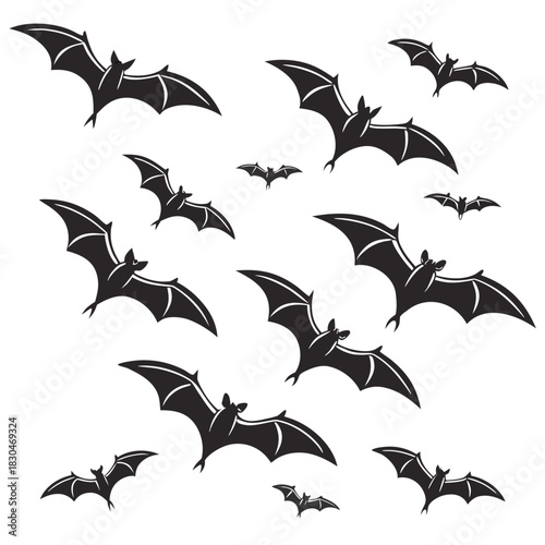 Vector illustration of a collection of black silhouette bats flying in various orientations