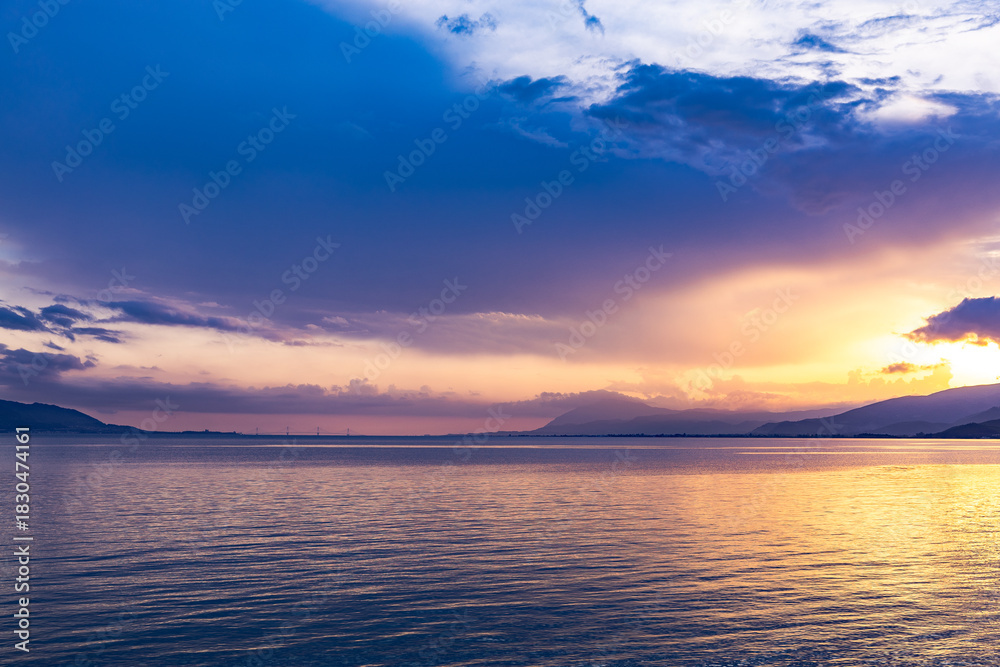 Fototapeta premium Aerial Drone View of Sunset over Gulf of Corinth, Central Greece, viewed from Skaloma
